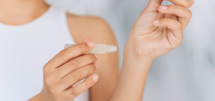The woman uses essential oils for her skin.