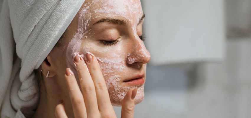 The woman cleans her face well to prevent milia from forming.