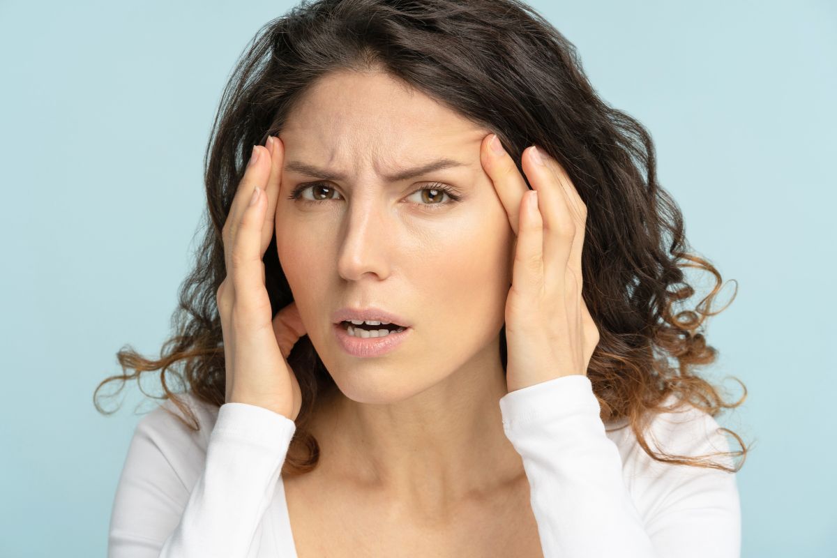 The woman noticed a milia on her face.