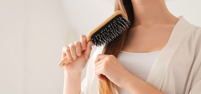 Does brushing hair stimulate growth: gentle brushing of long hair with natural-bristle paddle brush to improve circulation and support potential hair growth