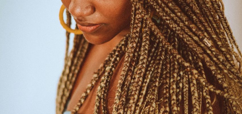 Close-up side view of jumbo knotless braids with neatly parted sections and smooth, lightweight braiding for a natural protective hairstyle.