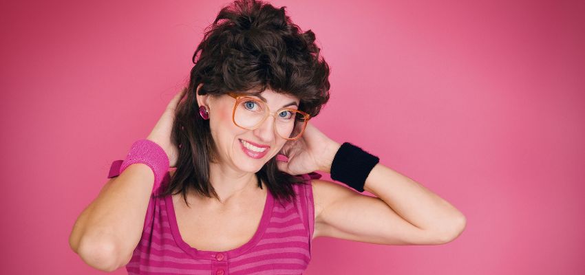 The woman has a traditional mullet hairstyle.