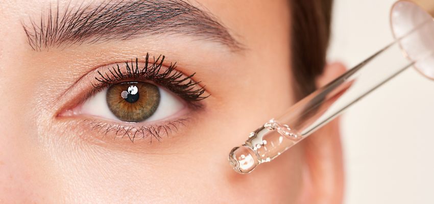 is-sodium-lauryl-sulfate-bad-for-hair1 Close-up of a brown eye receiving a clear serum drop from a dropper, illustrating gentle eye-area care in the context of "is sodium lauryl sulfate bad for hair" and related scalp/skin irritation concerns