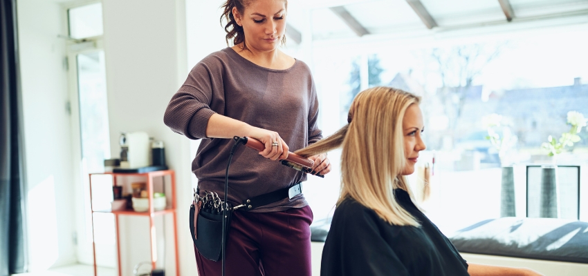 A stylist is the best fit for longer hair that needs layering, shaping, or added texture.
