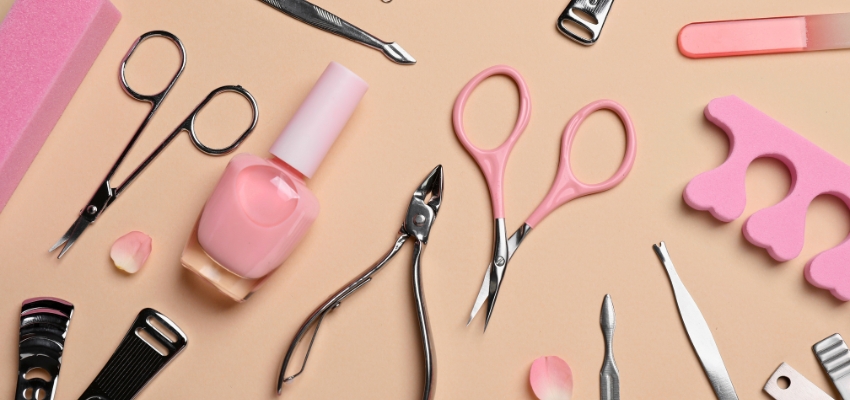 Essential nail tools, polish, and supplies arranged as top nail tech must haves