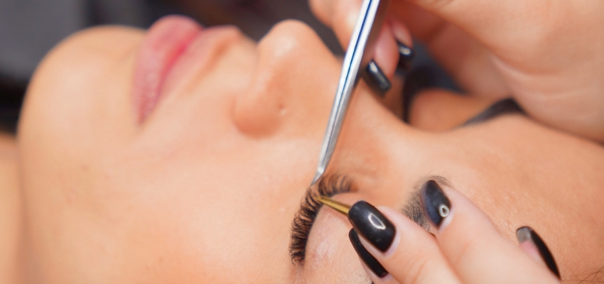 volume-lashes1 Technician carefully applying volume lashes during a professional eyelash extension service