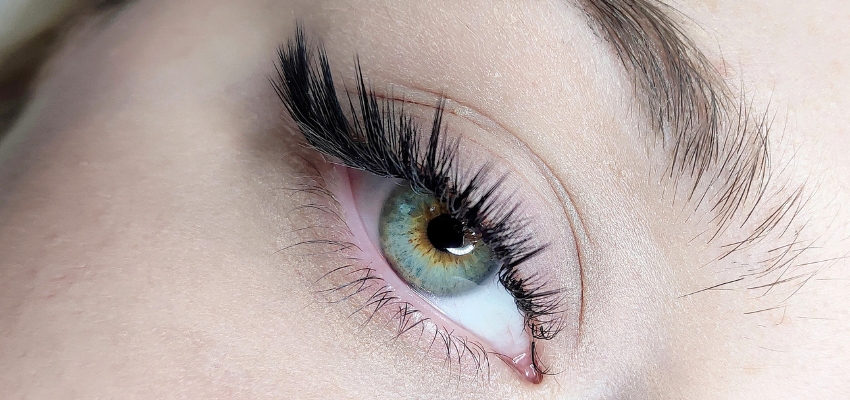 lash-extension-aftercare1 Close-up of an eye with long lash extensions, showing the benefits of consistent lash extension aftercare.
